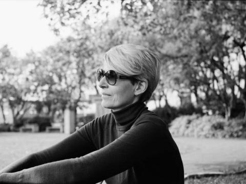 Ellý Katrín wearing sunglasses sitting outdoors