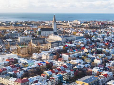 Aerial view of Reykjavík looking over the city center, with Hallgrímskirkja in the middle of the frame.