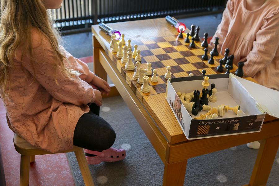 Girls playing chess at Rauðhóll Preschool