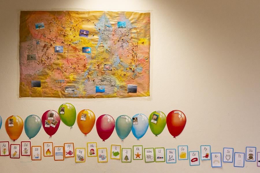 Artwork and the alphabet on the wall at Bakkaborg.