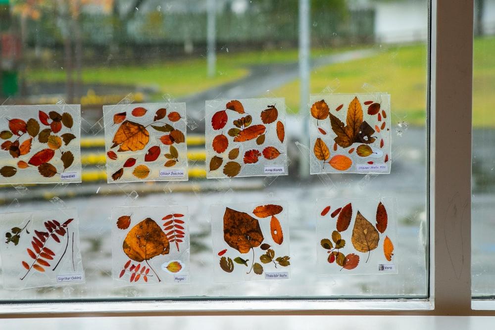 Fine arts made from leaves in the window at Bjartahlíð preschool