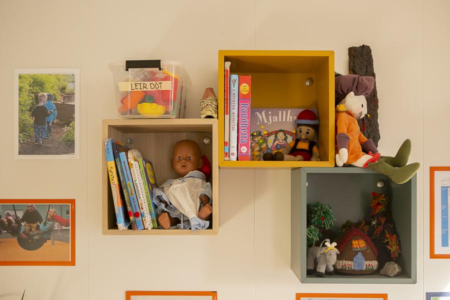 Books and toys on shelves inside Engjaborg.
