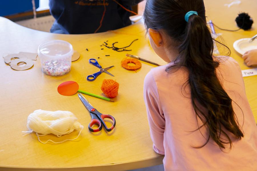 Children doing crafts inside Holt.