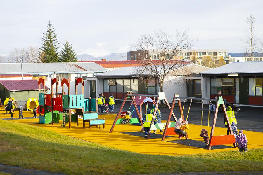 Children and playground equipment on Holt's grounds.