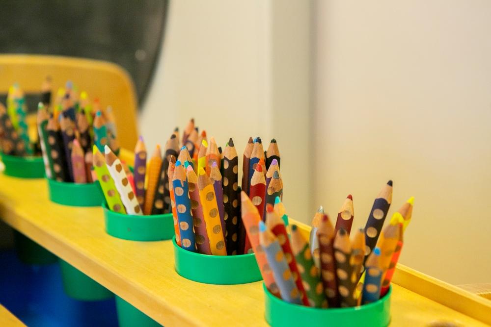 Colored pencils in jars