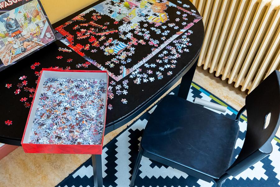 A table with a puzzle on it.