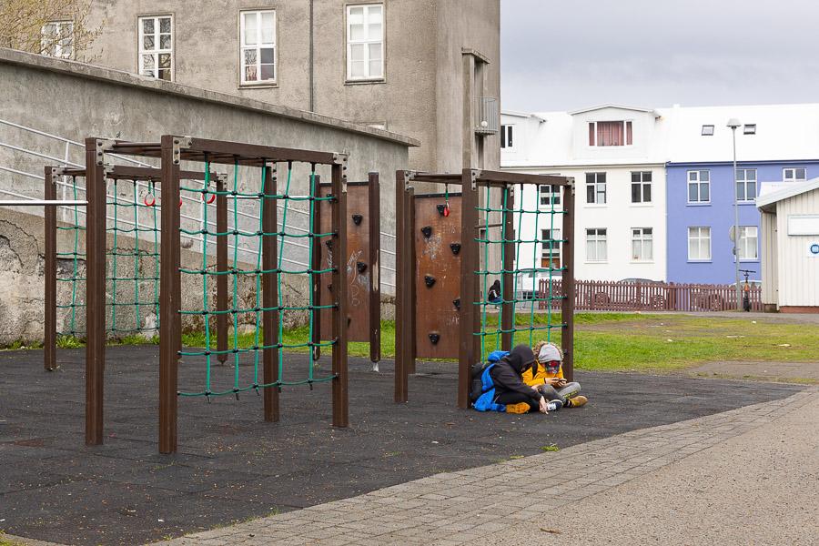 Jungle gyms and children in the outdoor area of the Draumaland after-school program