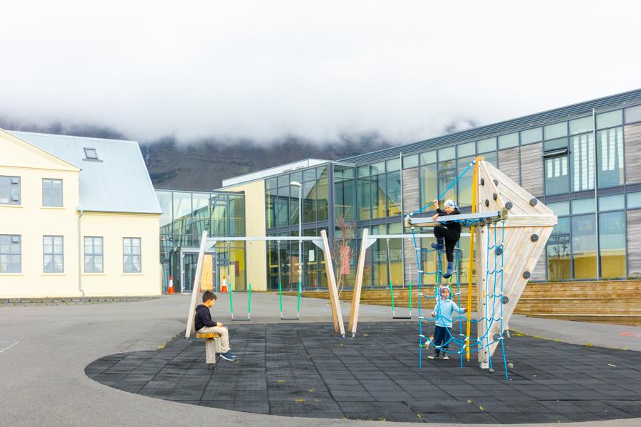 Jungle gym and swings on a school playground. 