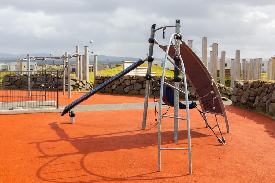 Jungle gym on a red surface. 