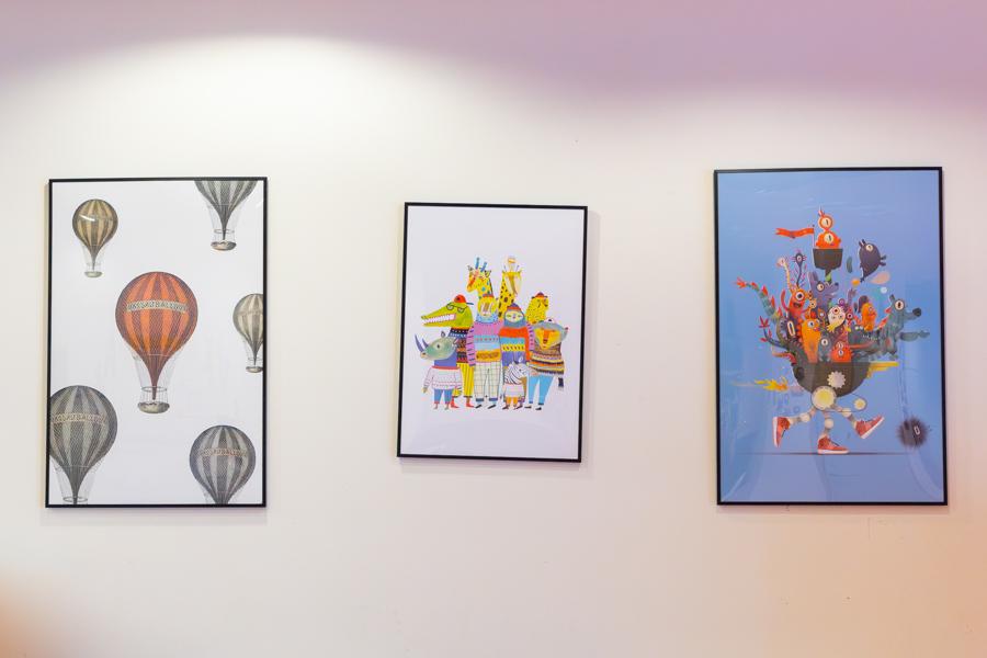 Wall pictures of balloons, dressed animals and various figures. 