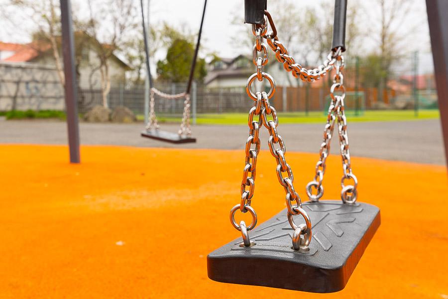 Swings on an orange-colored field.