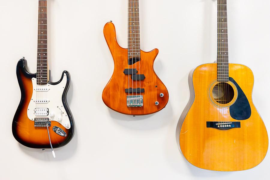 Guitars mounted on the wall. 