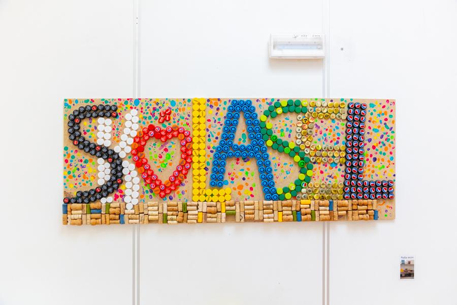 Artwork made from bottle caps forming the word Skólasel.