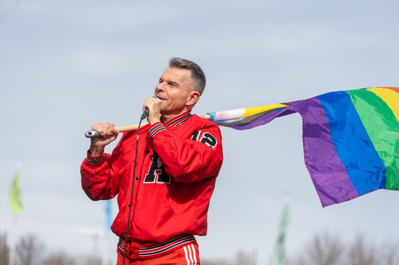 Páll Óskar holding the Rainbow Flag