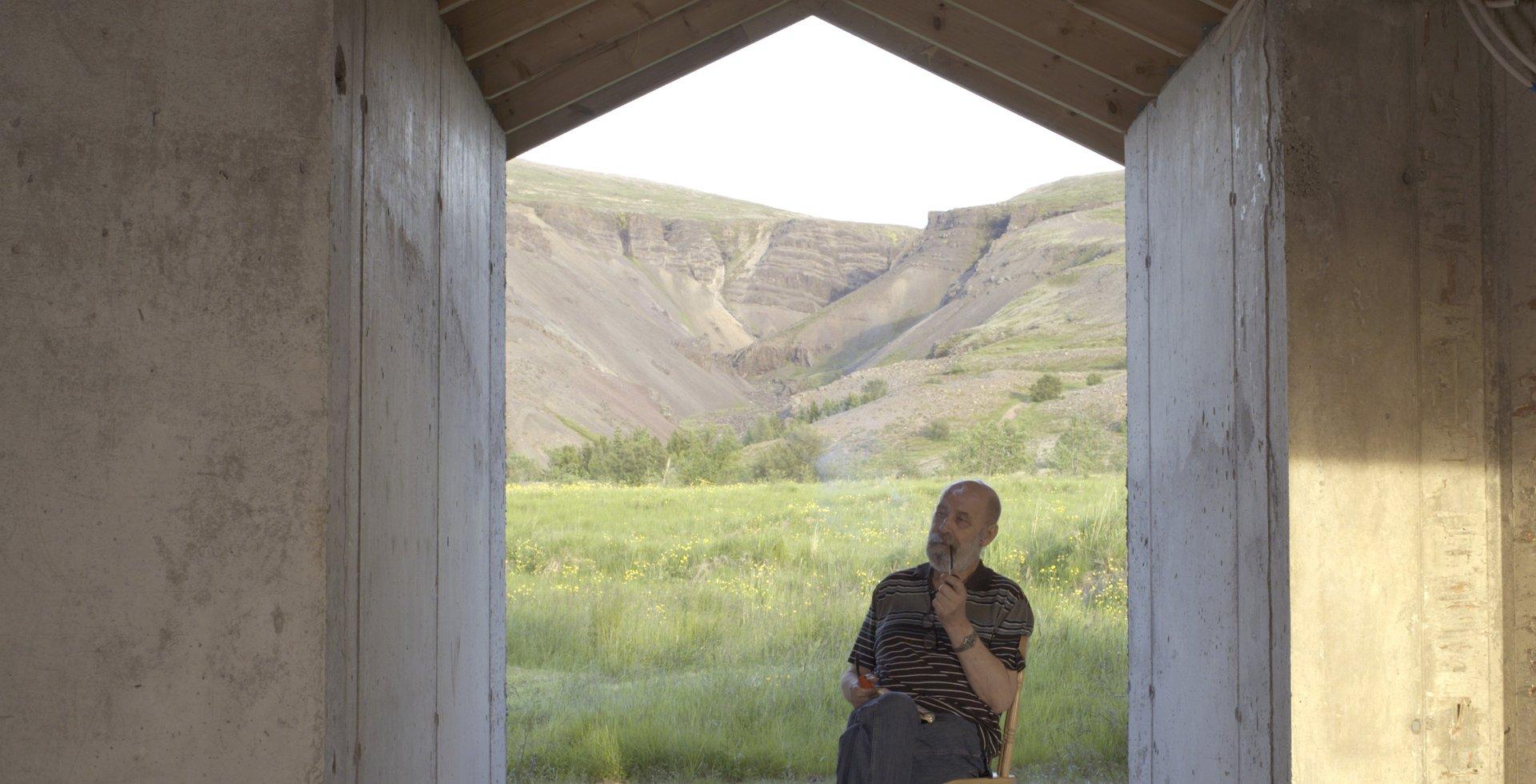 A man with a pipe chanting