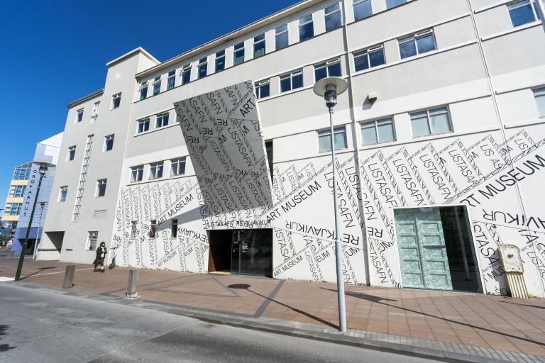 Reykjavík Art Museum, viewed from the outside, looking west. A clear sky overhead.