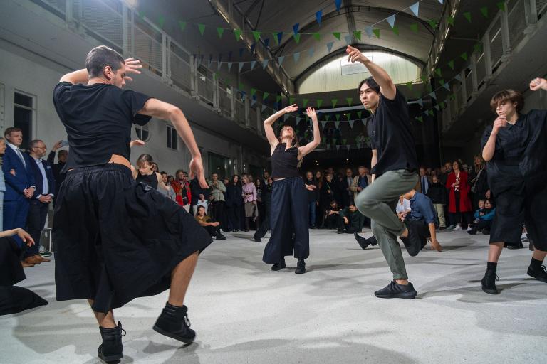 A scene from the opening of the 2024 Reykjavík Arts Festival. People dancing inside Hafnarhús as a large crowd watches.