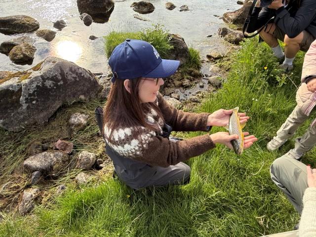 She caught and released a small brown trout at Breiðan.